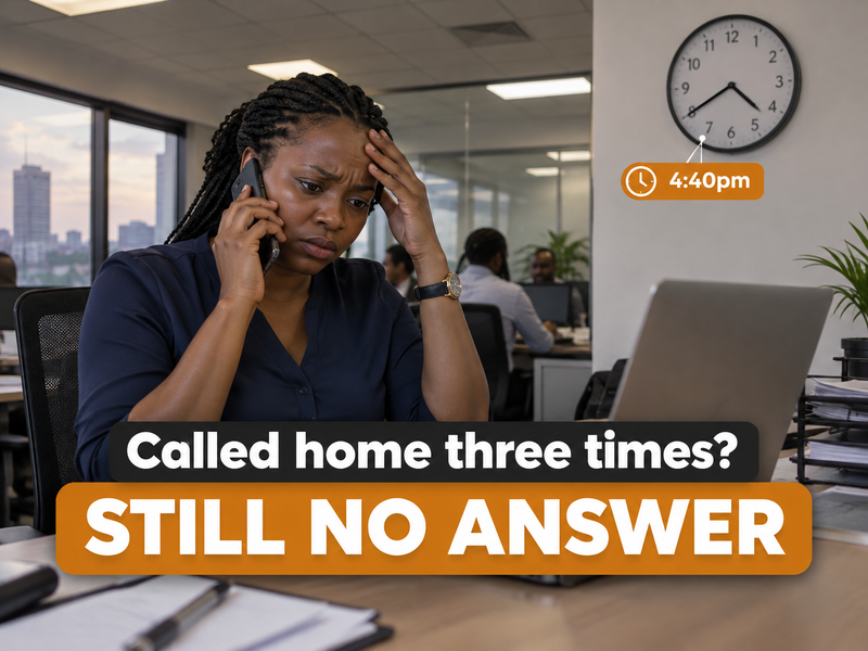 A mother at her office desk waiting for a call back