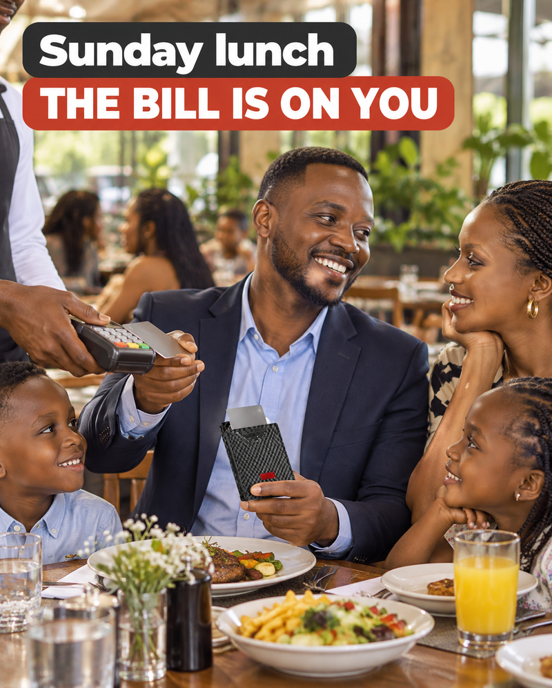A man at a restaurant table on Sunday, a card up from his wallet as the waiter brings the bill